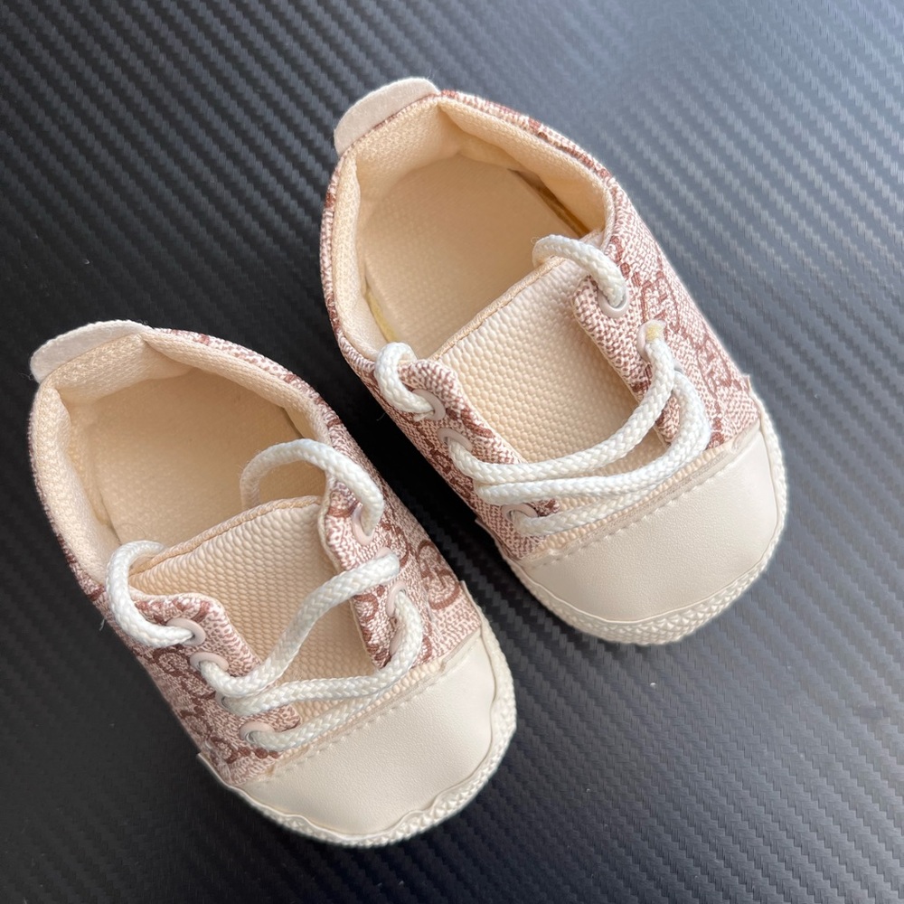 BRAND NEW, NEVER WORN baby shoes in the Gucci monogram design.